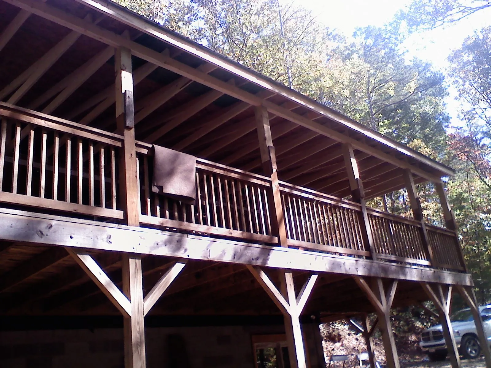 Timber framing under a new elevated porch and deck — Roof Leak Repair in Gentry by Roofing Brothers